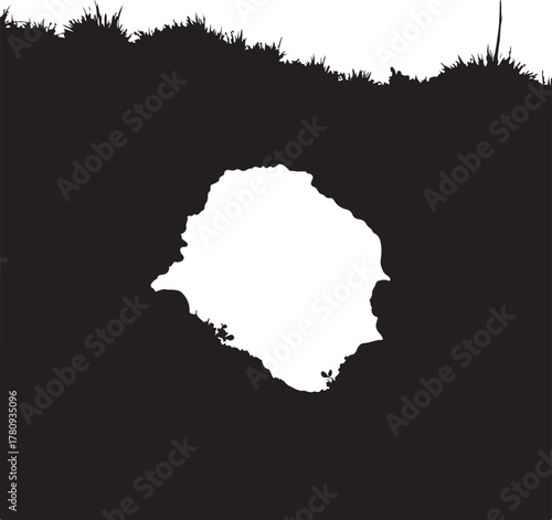 Black silhouette of grass and rock opening with white negative space