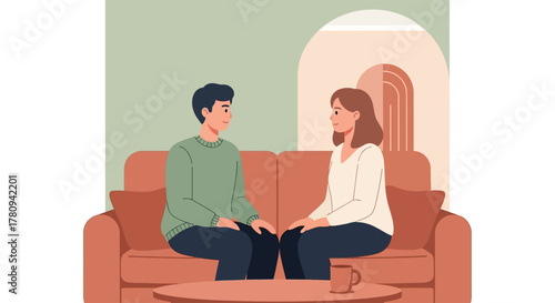 Couple sitting on a couch having a serious conversation in a living room setting.