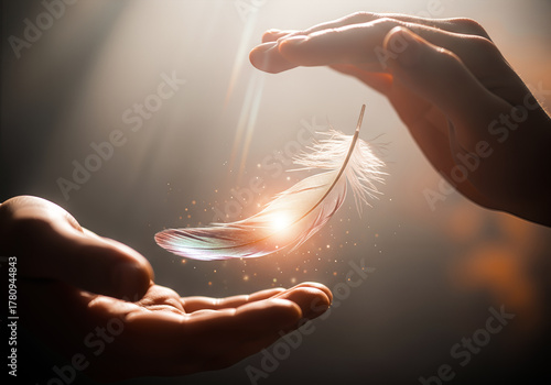 Close up elderly hands releasing a luminous feather into young hands symbolic meaning responsibility kindness wisdom
