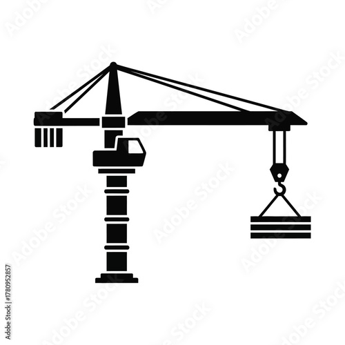 Strong black silhouette of a construction tower crane lifting a load