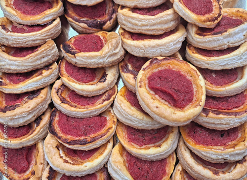 macro of large quantity of tasty red pizzas for a party