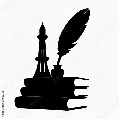 Silhouette of blackpool tower and quill pen in inkwell on stacked books against a white background