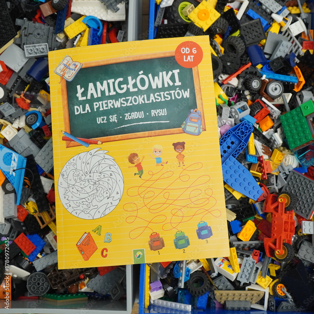 Obraz premium Educational puzzle book for first graders with colorful illustrations and fun activities