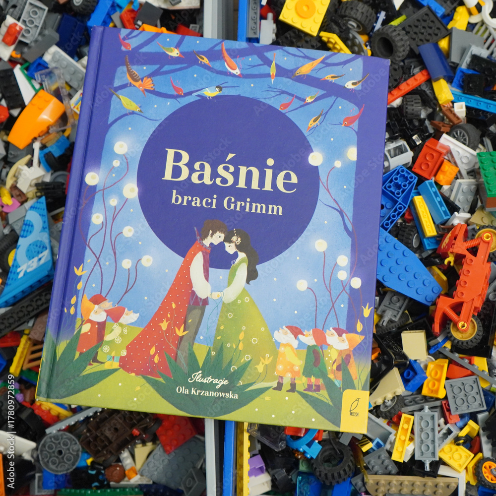 Obraz premium Polish edition of Grimm's Fairy Tales with colorful illustrations on a background of toy blocks