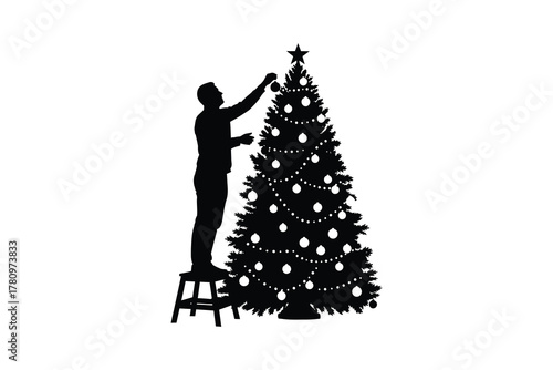 Silhouette of a man on a stool decorating a Christmas tree with ornaments and lights person