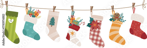 Christmas socks and stockings hanging on a rope with clothespins. Perfect for the festive Christmas season, as well as fall and winter merchandise.