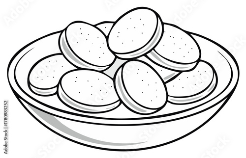 Bowl of sliced potatoes prepared for cooking or serving