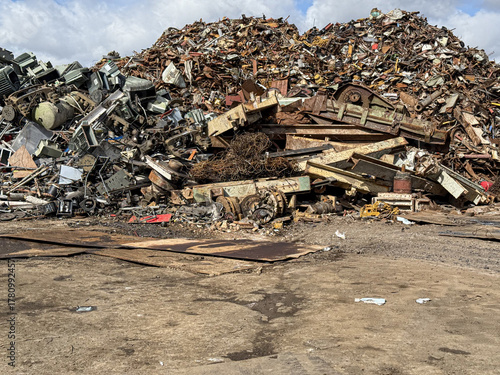 Photos Large pile of scrap metal awaiting recycling in junkyard