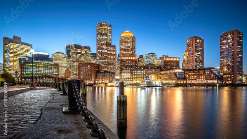 The historic architecture of Boston in Massachusetts, USA at night showcasing the Boston Harbor and Financial District.