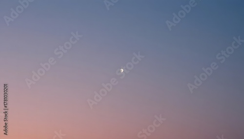 Evening sky gradient with faint moon visible.
