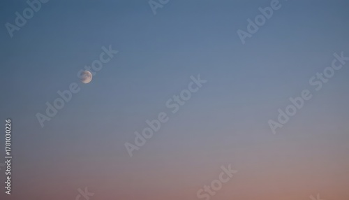 Evening sky gradient with faint moon visible.