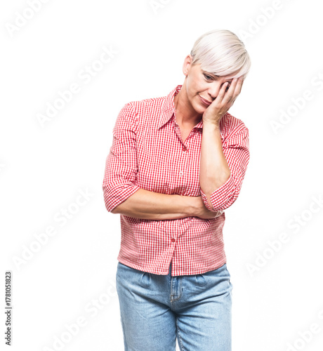 Ashamed woman covering face with hand. Shame, isolated on white background. Guilty middle aged woman.