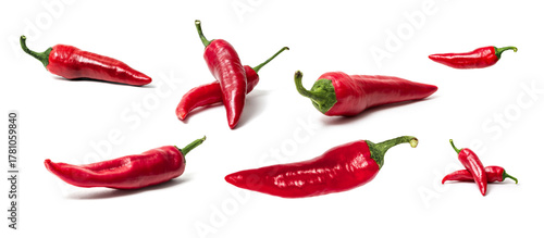 Set of red hot chili peppers isolated on white background. Spicy vegetable composition in different positions and arrangements. Fresh and vibrant food concept for cooking, design, or advertising use.