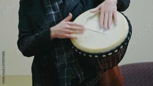 community participants collaboratively create rhythm around djembe in harmony and improvisation