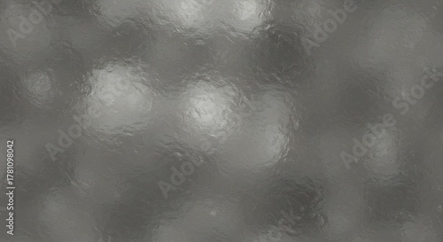 Gray mottled surface with blurred reflections suggests a textured or distorted material