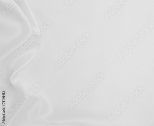 Smooth elegant white silk or satin luxury cloth texture as wedding background. Luxurious background design