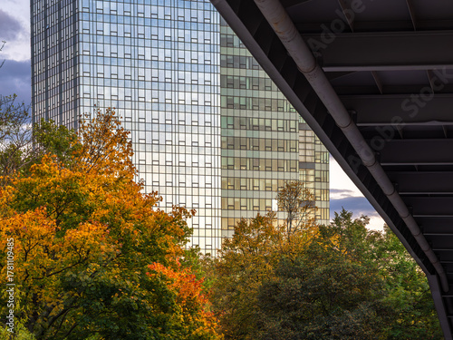 Canvas Print Glass Skyscraper with Autumn Trees and Bridge, Bratislava, Slovakia