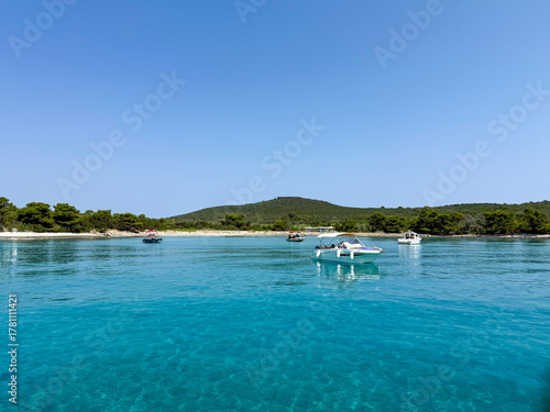 Fototapeta Naklejka Na Ścianę i Meble -  Crystal Clear Waters and Boats in a Serene Bay