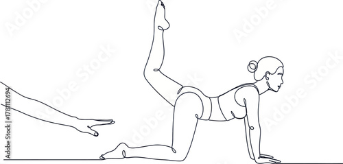 Woman doing donkey kick exercise with trainers hand nearby