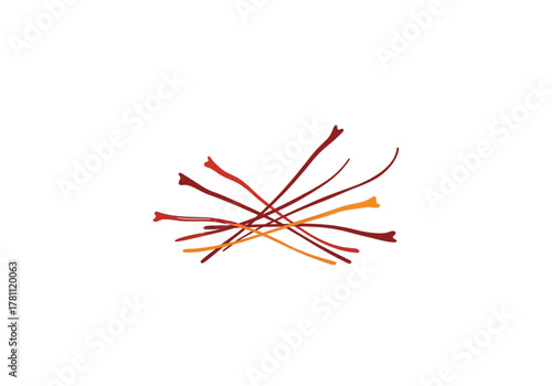 A pile of saffron threads with brown red and orange hues intermixed