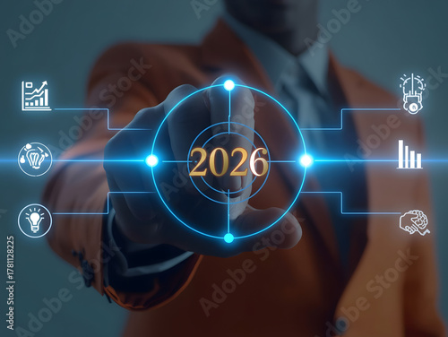 Confident leader targets future success by 2026, visualizing growth, innovation, and strategic planning with digital interface.