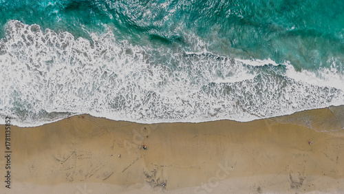 Bild auf Leinwand Aerial nature top down ocean waves on the beach southern Del Mar San Diego Calif