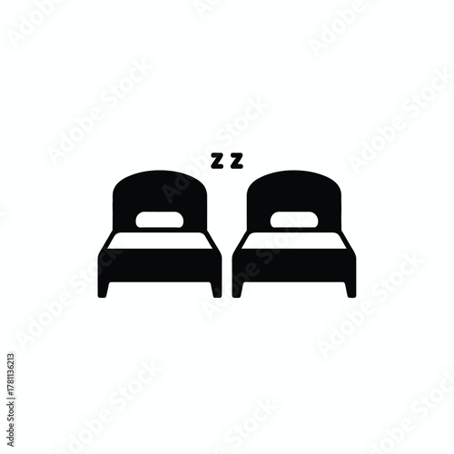 Simple silhouette icon of two beds with zzz symbols for sleep