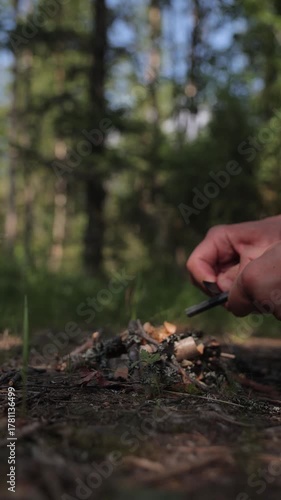 Lighting a fire by striking sparks from a flint	