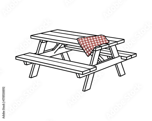 A wooden picnic table with a checkered cloth draped over it sits outdoors.