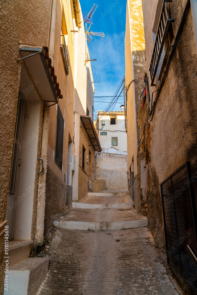 Fototapeta premium Narrow town street in Elche de la Sierra, Albacete (Spain). 