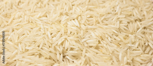 Close-up texture of uncooked Basmati rice. food backgrounds, culinary visuals.