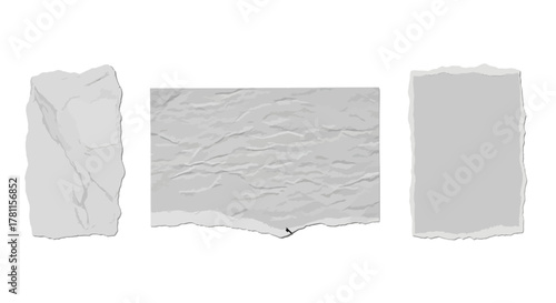 Three gray torn paper pieces with textured surfaces and irregular edges in a row
