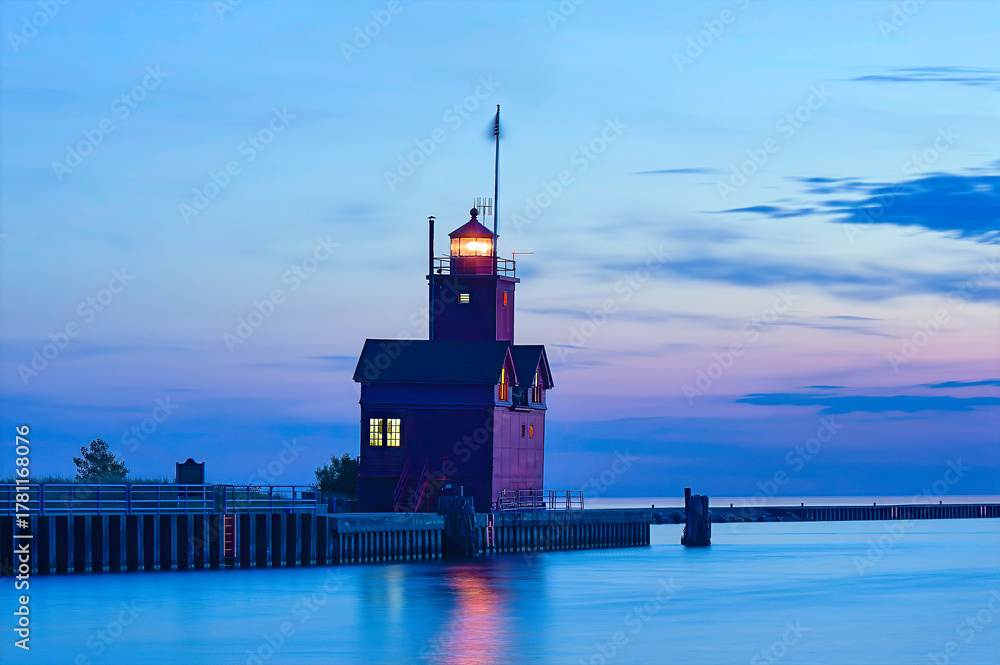 Fototapeta premium red lighthouse at dusk