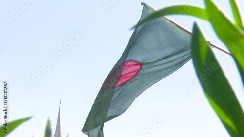 National flag waving gently in clear blue daytime sky