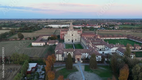 Certosa di Pavia aerial view at sunset Gra-Car (Gratiarum Carthusia, Monastery of Santa Maria delle Grazie - Sec. XIV),Pavia, Italy.