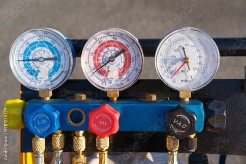 4-way manifold gauge set, pressure gauge. Maintenance and repair of refrigeration and air conditioning or HVAC system. Industrial equipment for measuring