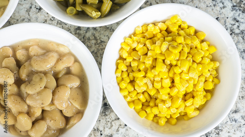 Freshly canned corn and beans ready to serve at a summer gathering in a cozy kitchen