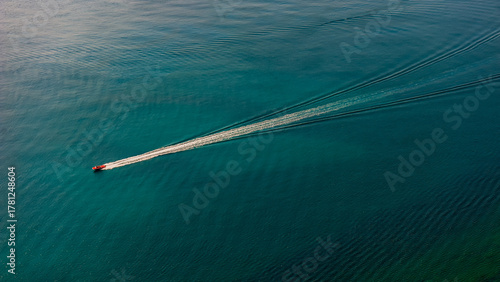 Tourists sailing on a pleasure boat at sea. Aerial view.