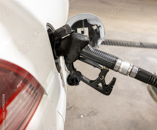 Man Refueling a Car at Gas Station