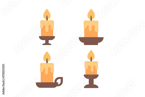 Collection of lit candles with melting wax standing on different decorative candle holders