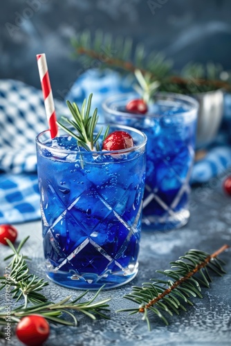 Scotland's National Day celebration table with blue frosty cocktails garnished with blueberries and rosemary. Elegant festive setup perfect for party themes