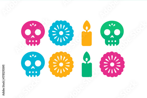 Brightly colored Calavera skulls and candles for Dia de Muertos celebration