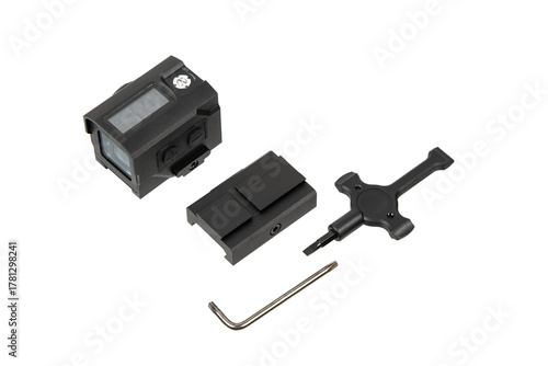 Disassembled black reflex sight, red dot, with mount and tools, isolated on white back