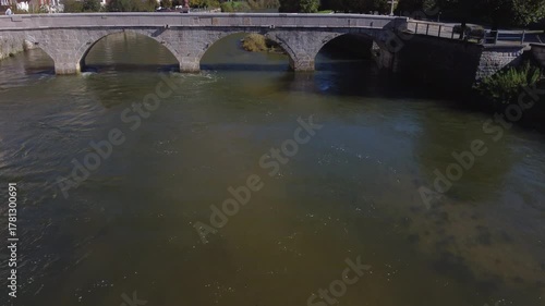 Wallpaper Mural Aerial view flying backwards revealing the historic Saint John Nepomucene bridge in Saint Ursanne Torontodigital.ca