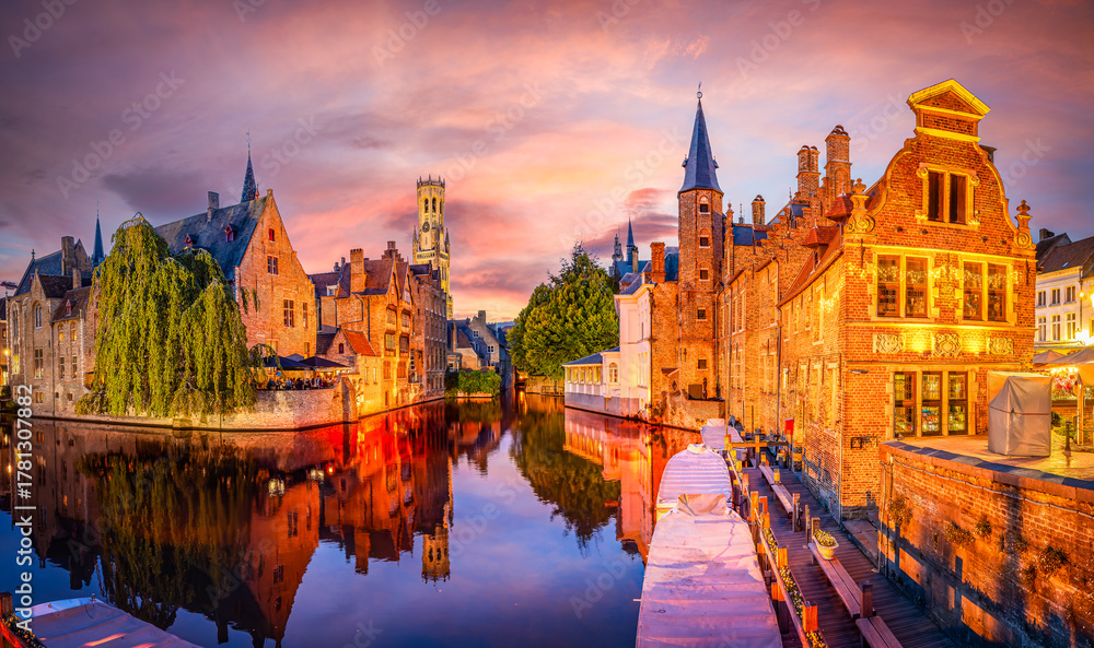 Fototapeta premium Sunset over Bruges with medieval architecture and peaceful canals in Belgium.