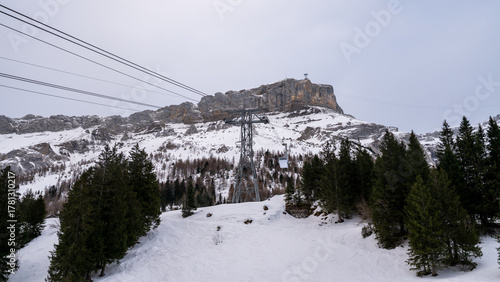Winter Cable Car Ride to Glacier 3000 with Snowy Forest and Scex Rouge Cliff, Les Diablerets, Swiss Alps, Switzerland.