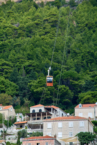 Iconic orange Dubrovnik cable car ascending Mount Srd