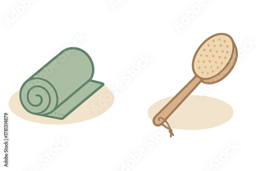 Rolled green yoga mat and wooden body brush for spa and self-care routines