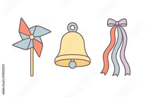 Cute pastel pinwheel toy, yellow bell, and decorative ribbon bow with streamers
