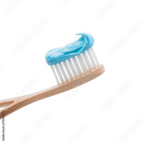 Bright Green Toothpaste on a Bamboo Toothbrush Ready for Clean Teeth in the M...